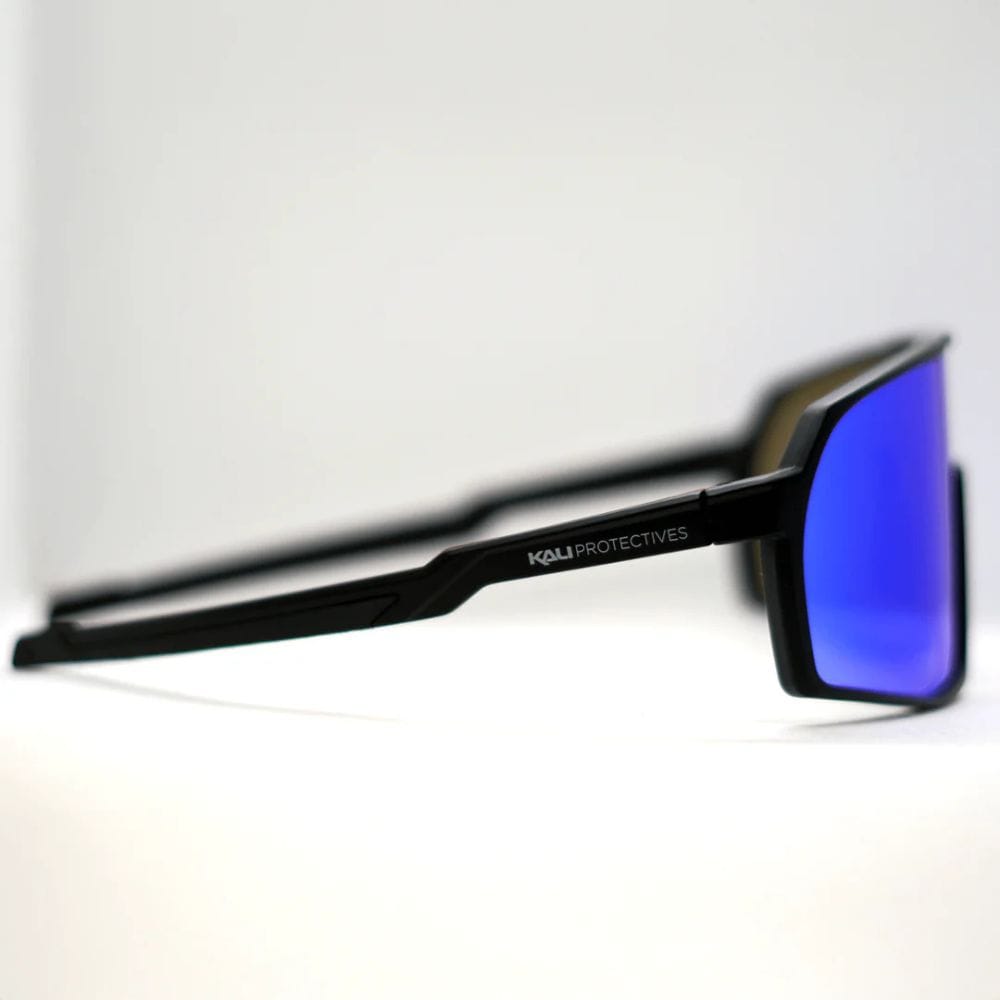 Black sunglasses with blue lenses on a white background