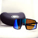 Sunglasses with blue and orange gradient lenses in front of a black case on a white background