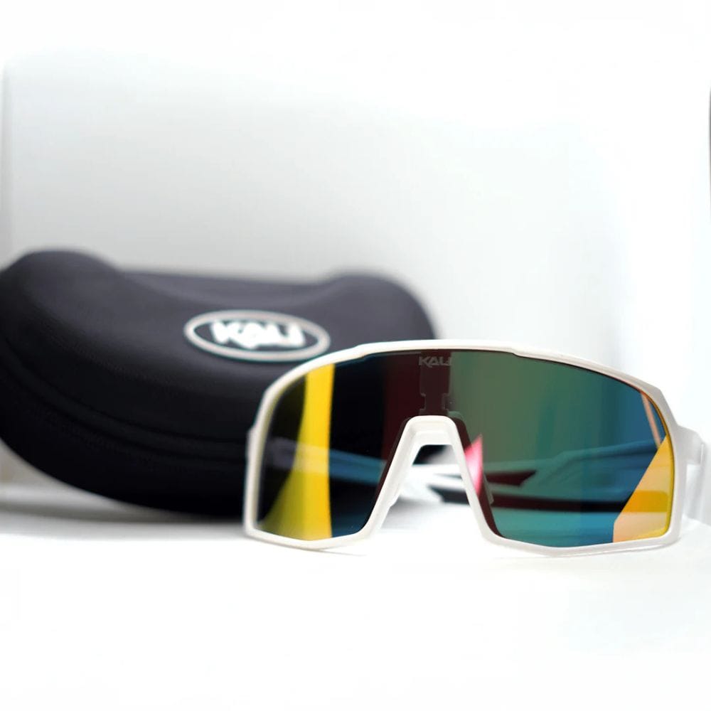 Sunglasses with reflective lenses and a black case on a white background