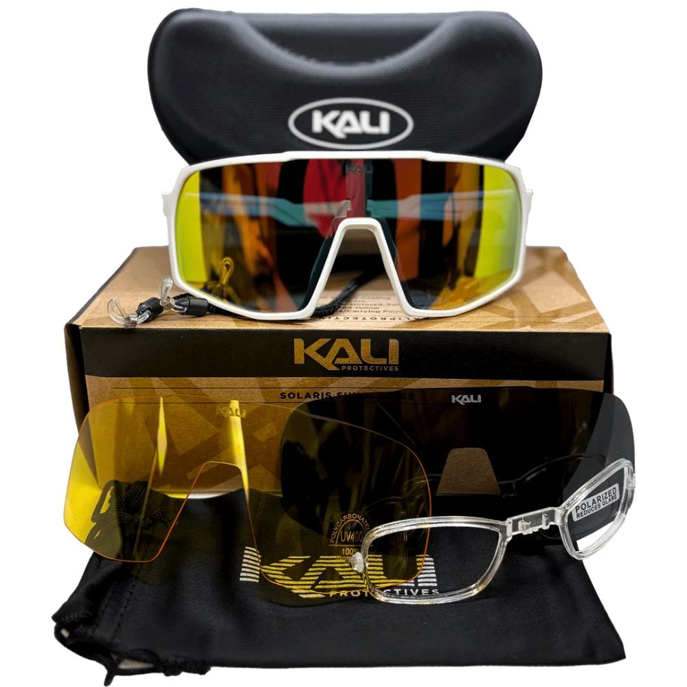 Kali sunglasses with reflective lenses, black case, and packaging on a white background